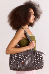 Damson Madder quilted weekender bag - washed black spot stripe print