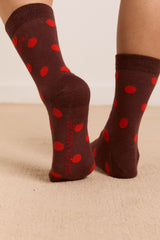 Damson Madder calf length socks in burg & red polka dot