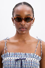 Damson Madder slim oval sunglasses with wavy temple in tort