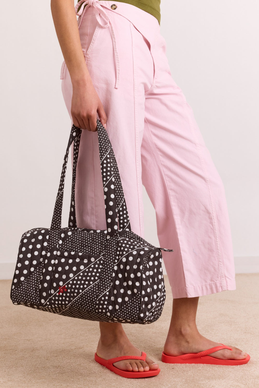 Damson Madder quilted weekender bag - washed black spot stripe print