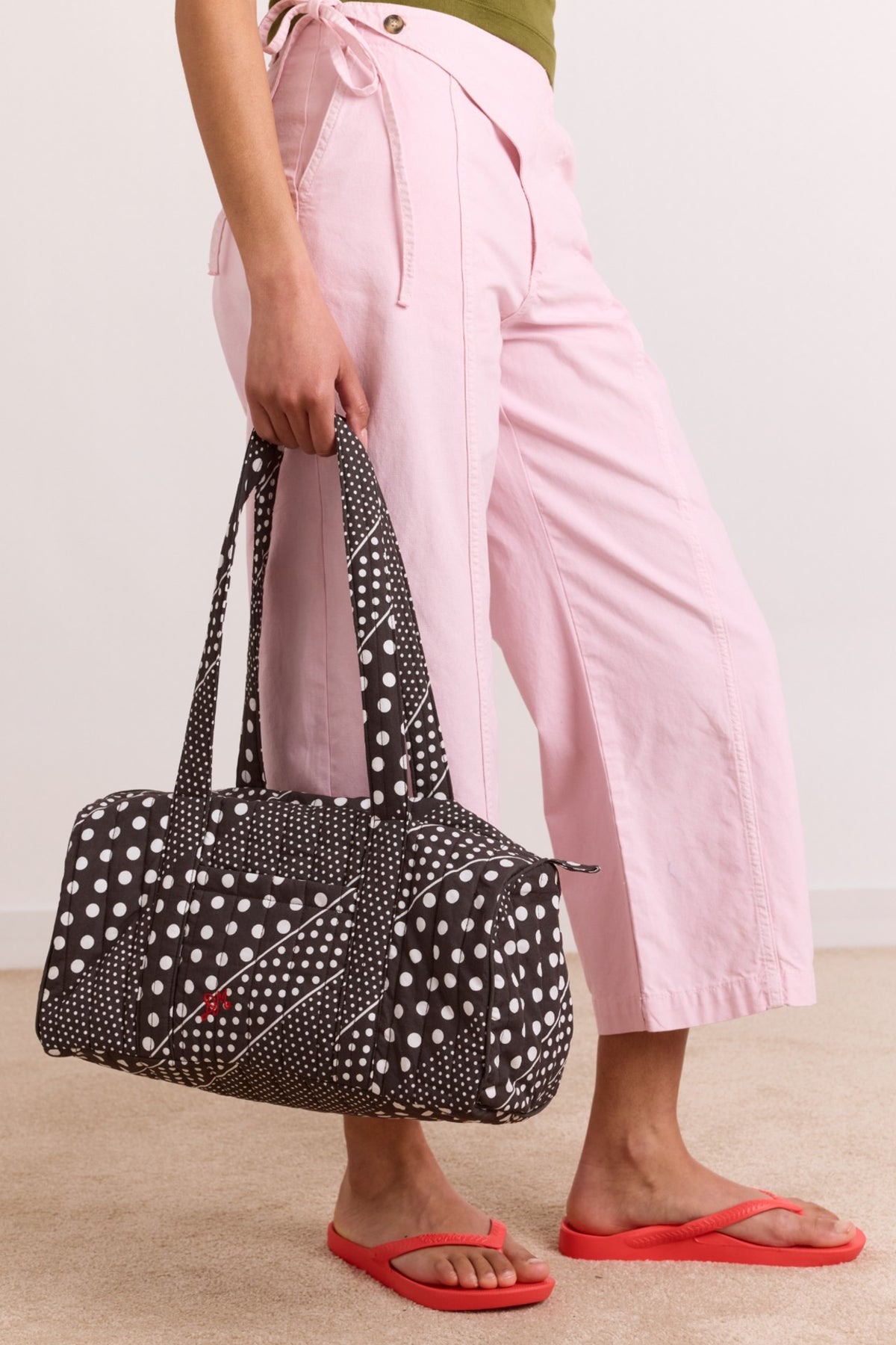 Damson Madder quilted weekender bag - washed black spot stripe print