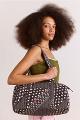 Damson Madder quilted weekender bag - washed black spot stripe print