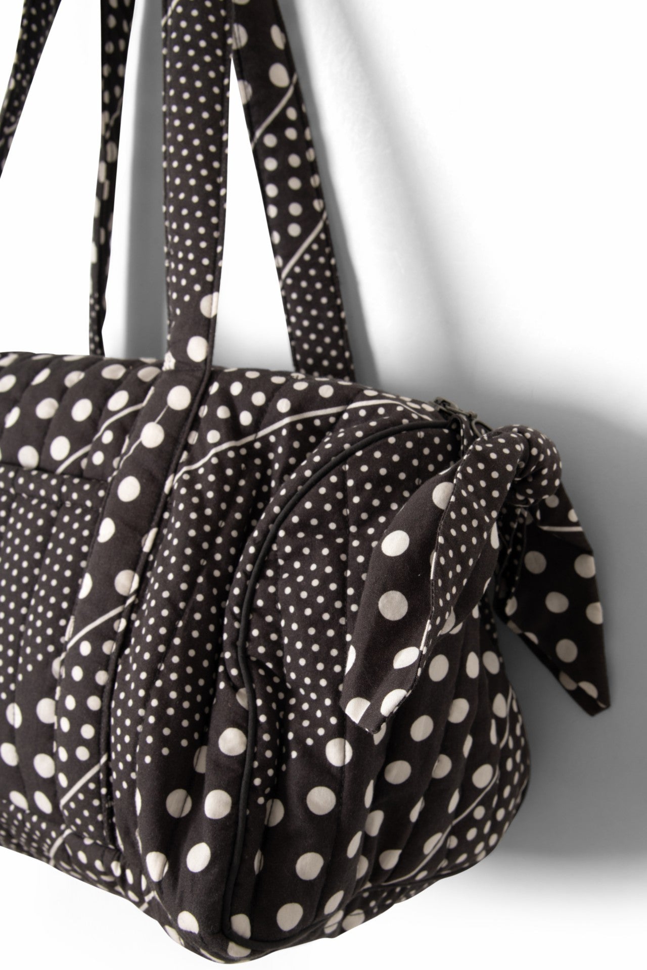 Damson Madder quilted weekender bag - washed black spot stripe print