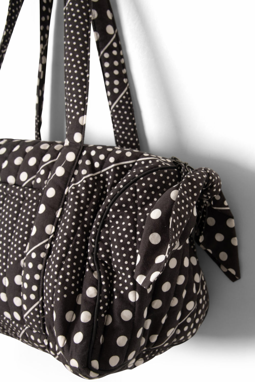 Damson Madder quilted weekender bag - washed black spot stripe print