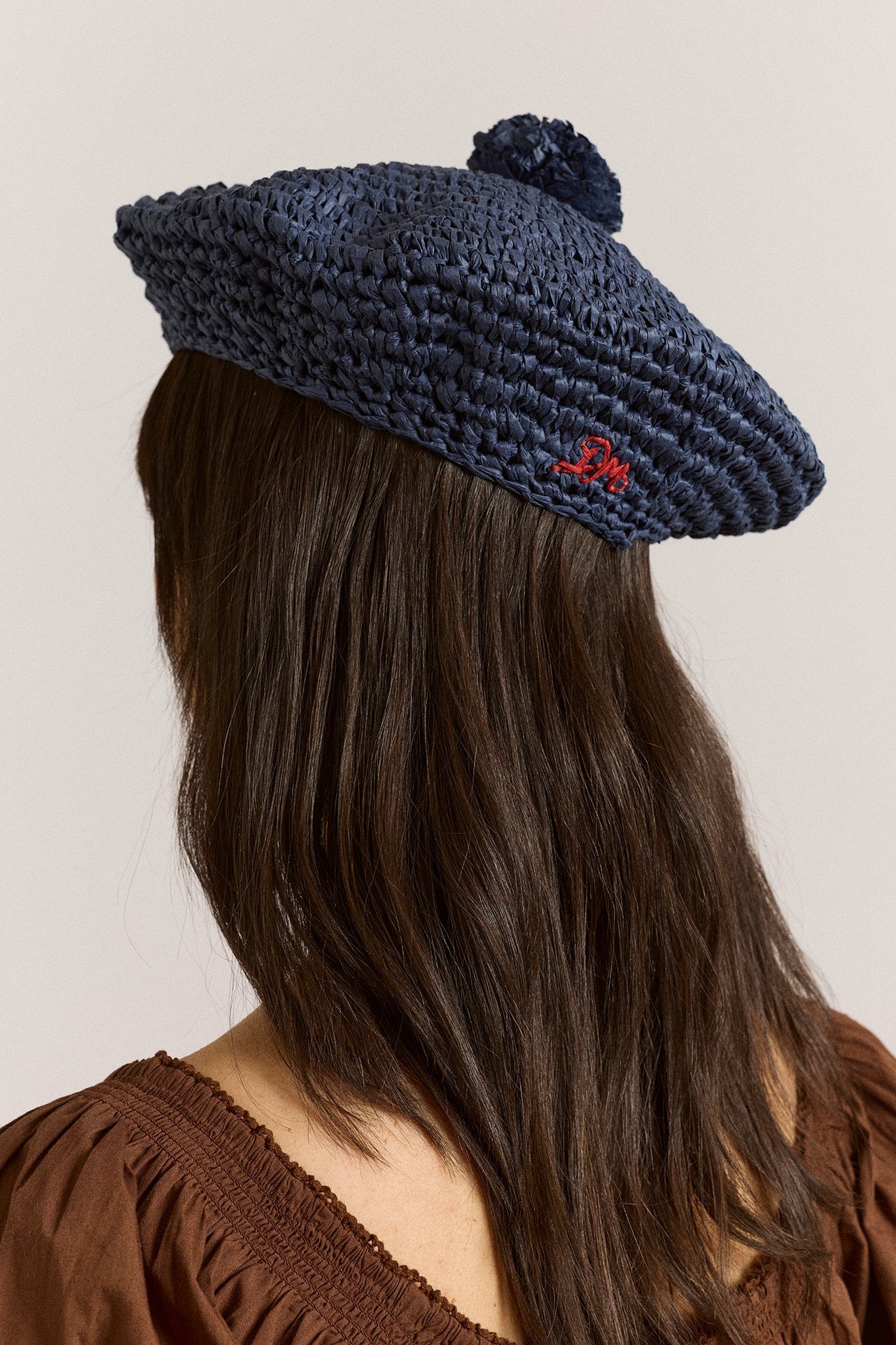 Damson Madder raffia pom pom beret - navy