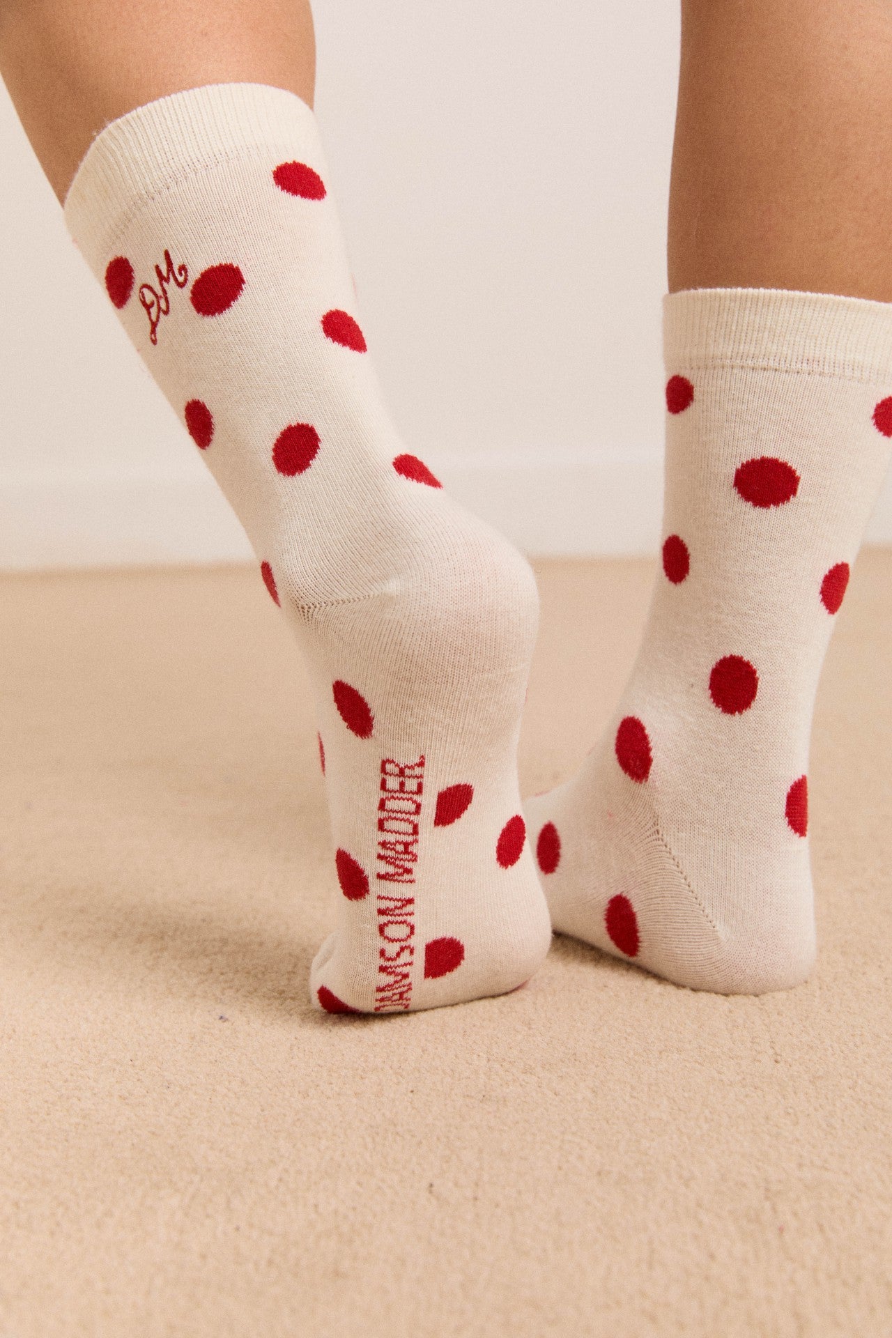 Damson Madder calf length socks in white & red polka dot