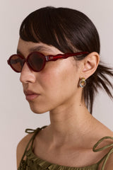 Damson Madder wavey temple sunglasses - crystal red