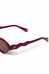 Damson Madder wavey temple sunglasses - crystal red