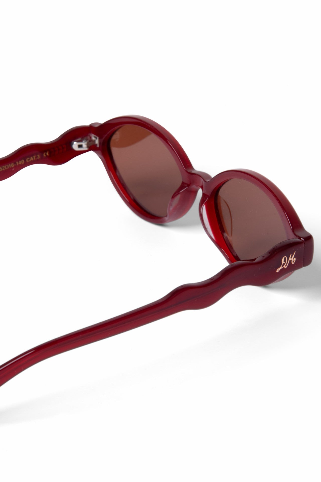Damson Madder wavey temple sunglasses - crystal red